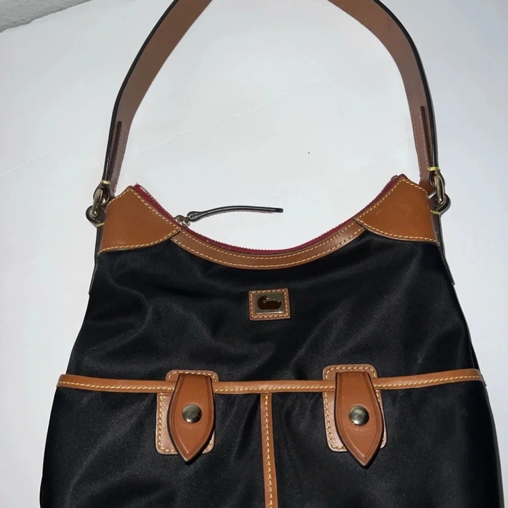 Dooney & Bourke Black Shoulder Bag with Brown Leather Trim and Red Interior